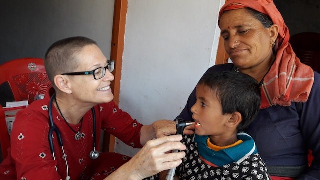 Dr Gina Jansheski performing medical checks on a child in India