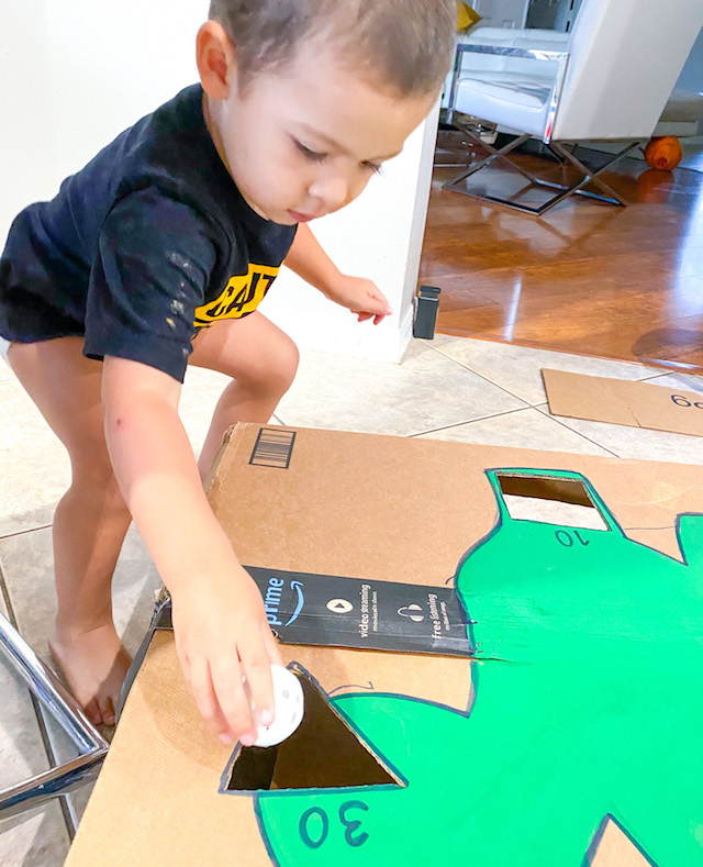 Toddler playing the learning dinosaur game