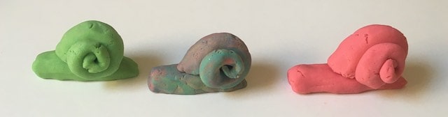 Playdough snails in a row